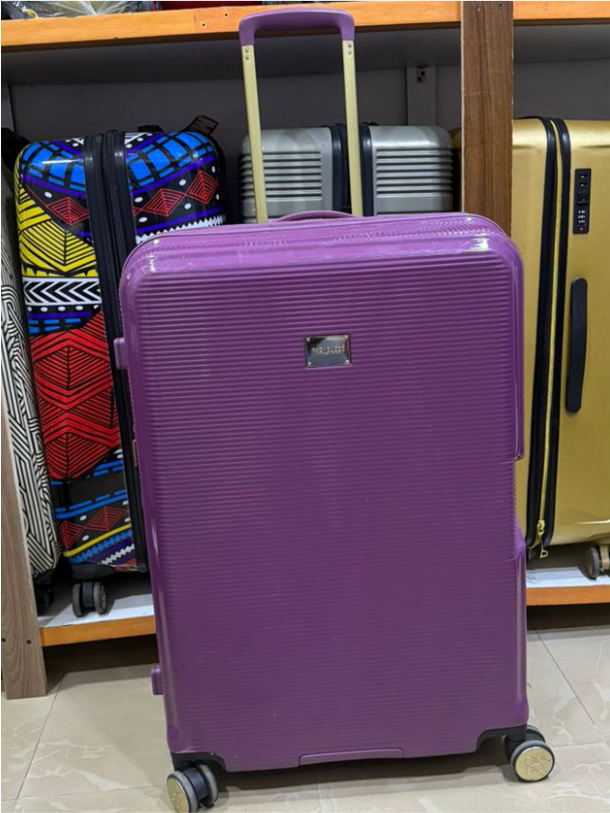Purple luggage in 23kg size